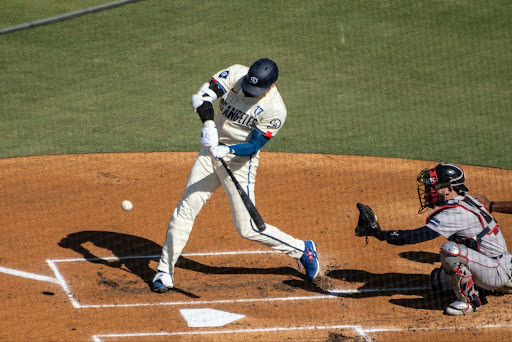 https://unsplash.com/photos/a-baseball-player-swinging-a-bat-at-a-ball-0eYeqBtRfBQ